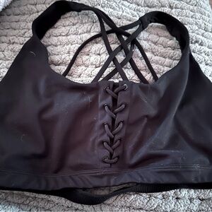 VS sports bra with accents on front. Color black, size is XL/XXL